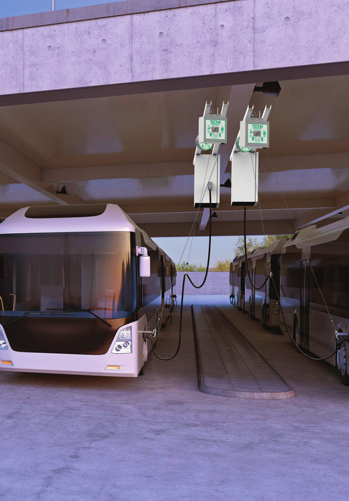 Cargue la imagen en el visor de la galería, Electric buses charging in a depot with overhead TECNA cable management
